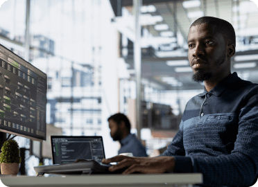 Person working on a computer in an office setting