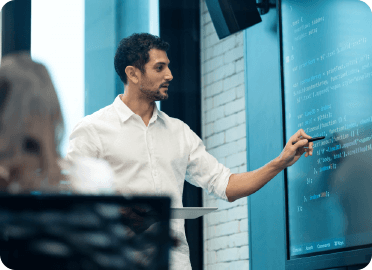 Presenter pointing at the board